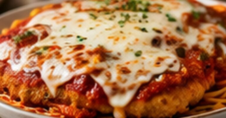 Olive Garden chicken Parmigiana copycat with breaded chicken, marinara, and cheese
