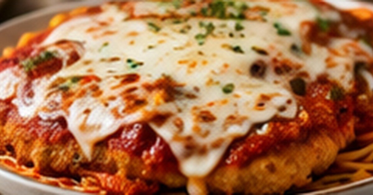 Olive Garden chicken Parmigiana copycat with breaded chicken, marinara, and cheese